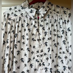 Smart, slightly sexy Free People blouse with covered buttons & long sleeves.